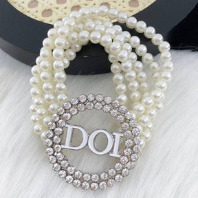 DOI Bracelet - White Pearls & Charm - Bricks Masons